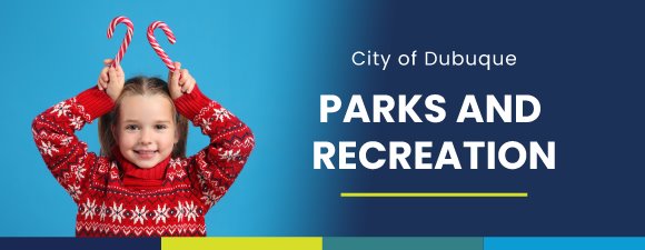 Girl in red Christmas sweater smiling holding candy canes up to her head like antlers