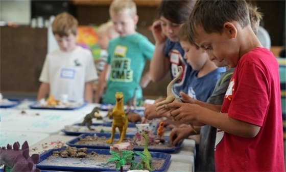 kids playing with dinosaurs