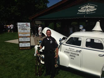 Captain Klein with two trophies.
