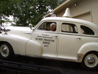 Butch Klein backs the car off the tow truck.