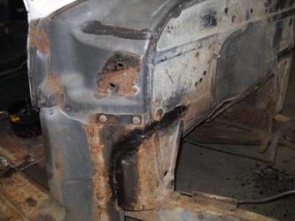 The firewall and post in front of the front passenger door.