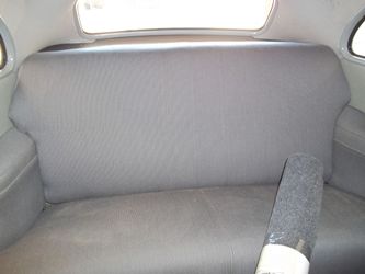 The rear seat was reupholstered and installed.