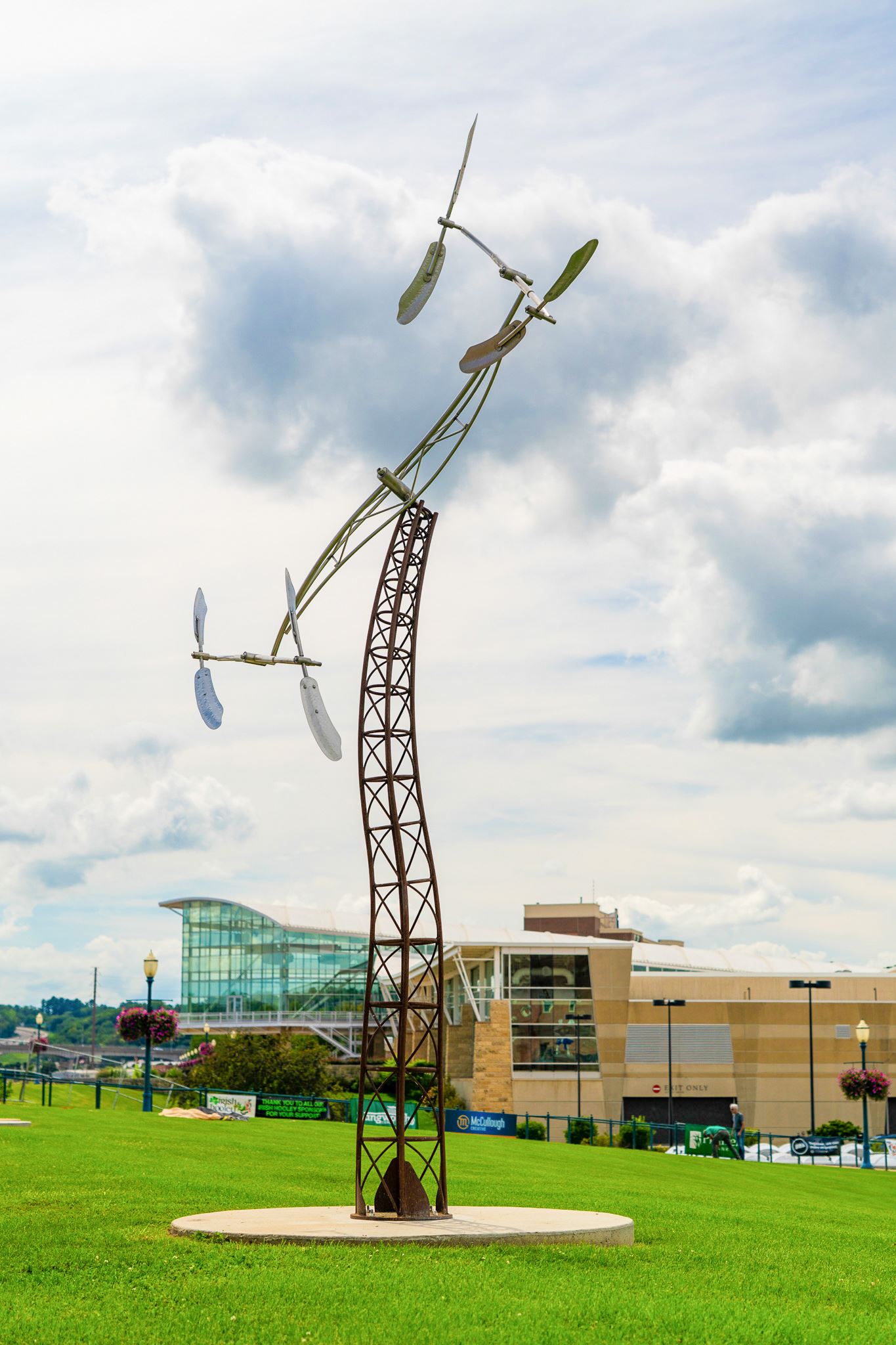 tall steel sculpture with spinning arms at top